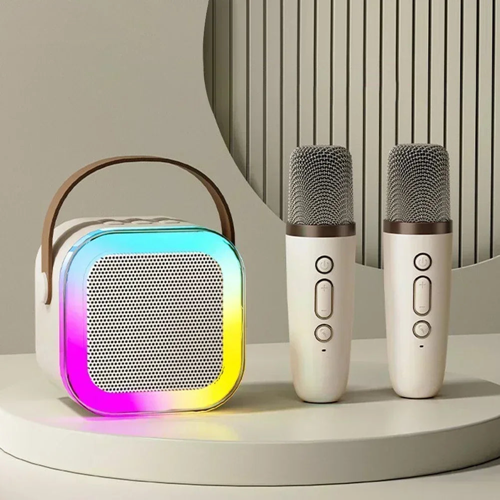 White k12 karaoke machine with wireless rgb lights and brown handle paired with two matching wireless microphones gift speaker