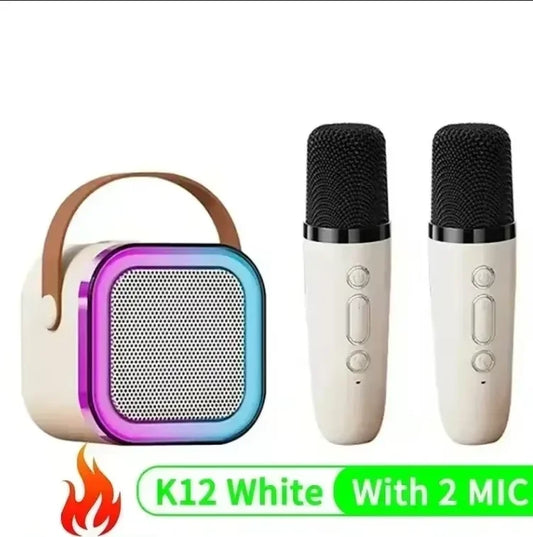 Cream-colored k12 karaoke machine with brown leather handle and wireless rgb lights paired with two white microphones