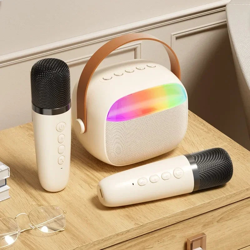 Cream-colored k30 karaoke machine portable bluetooth speaker with brown leather handle and rainbow led for family singing children’s uses with wireless microphones home