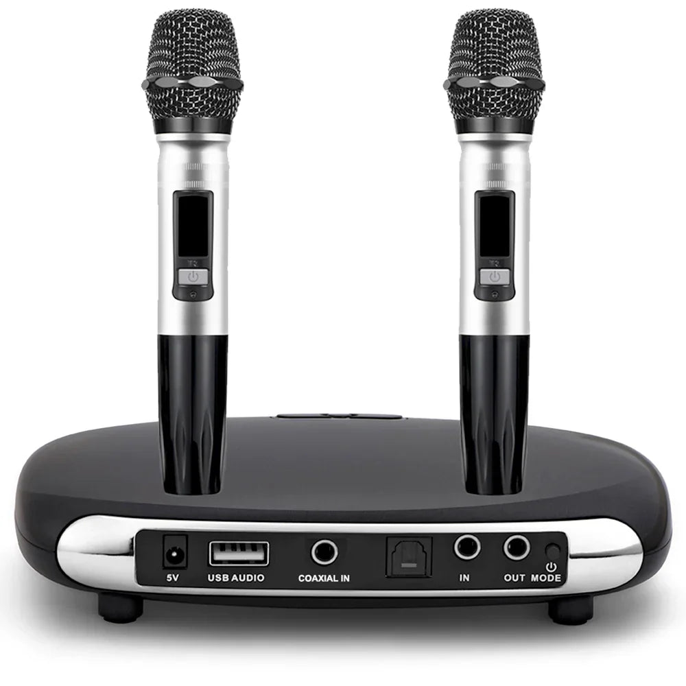 Two black and silver wireless microphones with mesh grilles sit on a black karaoke box microphone base unit with audio ports for home karaoke echo and karaoke echo mixer use