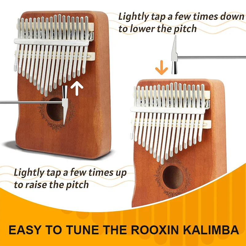 Brown wooden kalimba finger piano with silver metal tines and engraved floral design musical instrument mbira
