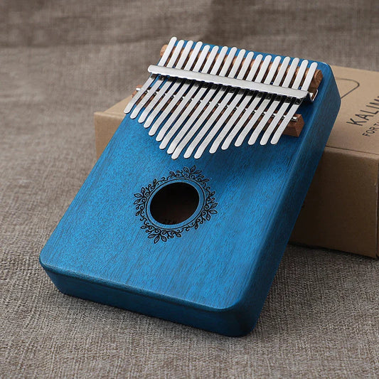 Blue wooden kalimba music instrument with silver metal tines and ornate black floral design kids portable mbira finger piano combinations