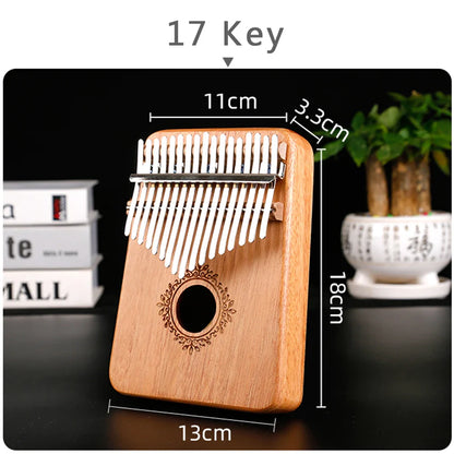 17-key wooden kalimba music instrument with natural mahogany finish white metal tines and ornate sound hole design