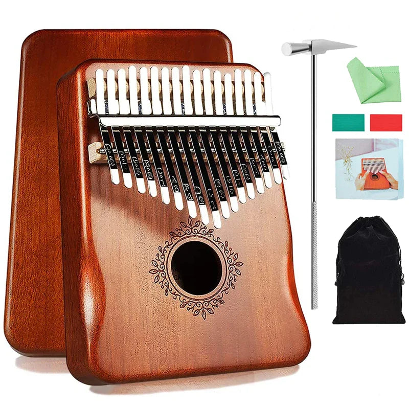 A polished mahogany wood kalimba music instrument thumb piano with 17 metal tines and ornate circular inlay