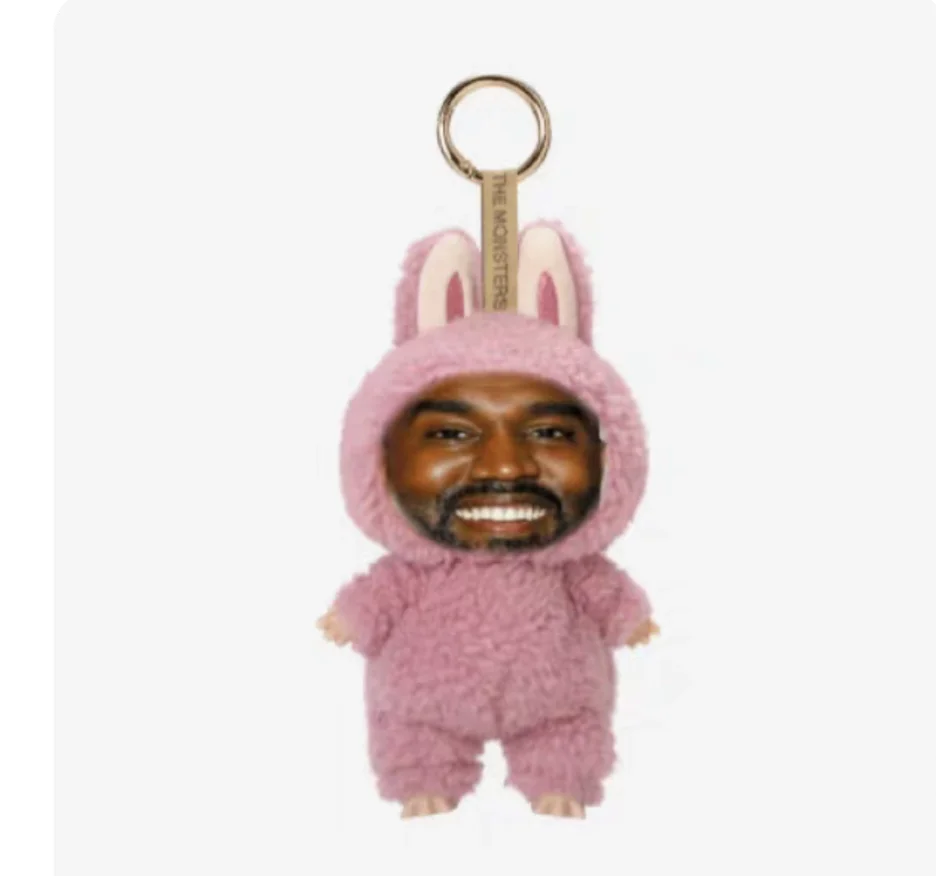 Pink fuzzy bunny onesie keychain with smiling face featuring kanye west layeye design birthday present trending toy trendy pendant