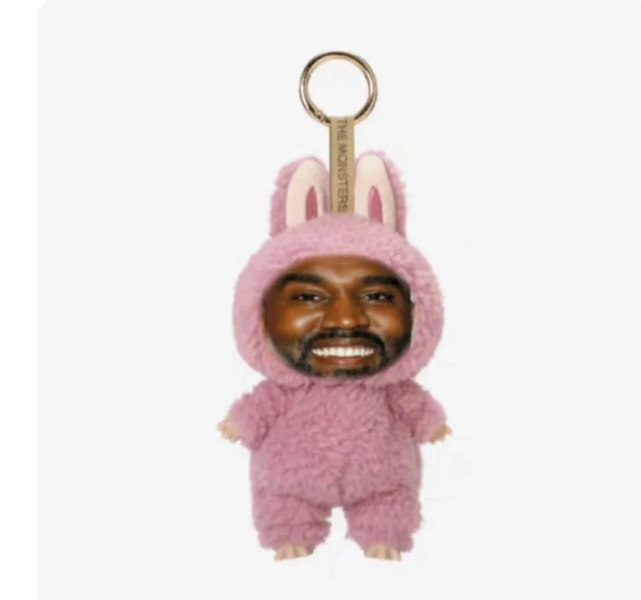 Pink fuzzy bunny onesie keychain with smiling face featuring trendy pendant design for layeye design birthday present trending toy
