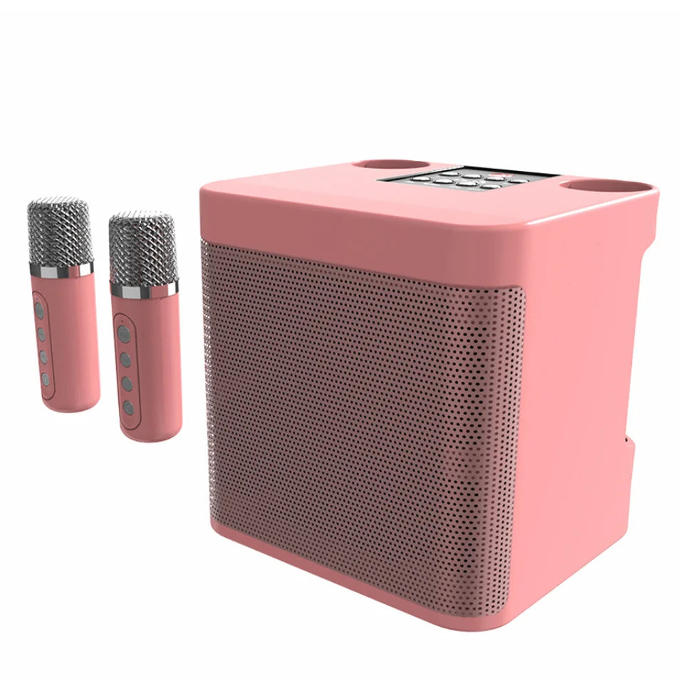 Pink portable bluetooth karaoke machine with square speaker housing metallic mesh grilles and two wireless mic home use