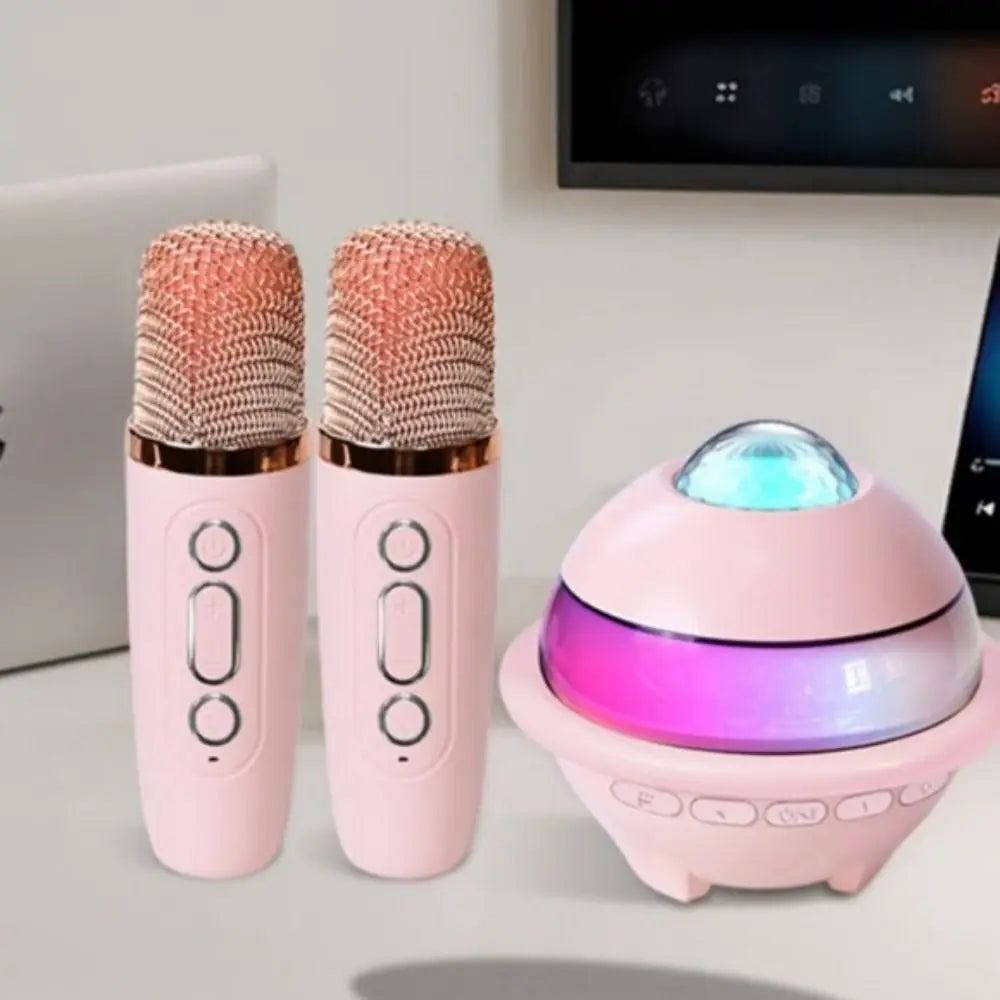 Pair of pink wireless dual microphones with rose gold mesh grilles for karaoke machine mini with projector night light