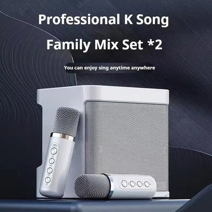 Silver wireless dual microphones with metallic grille and control buttons paired with portable boombox player voice changer