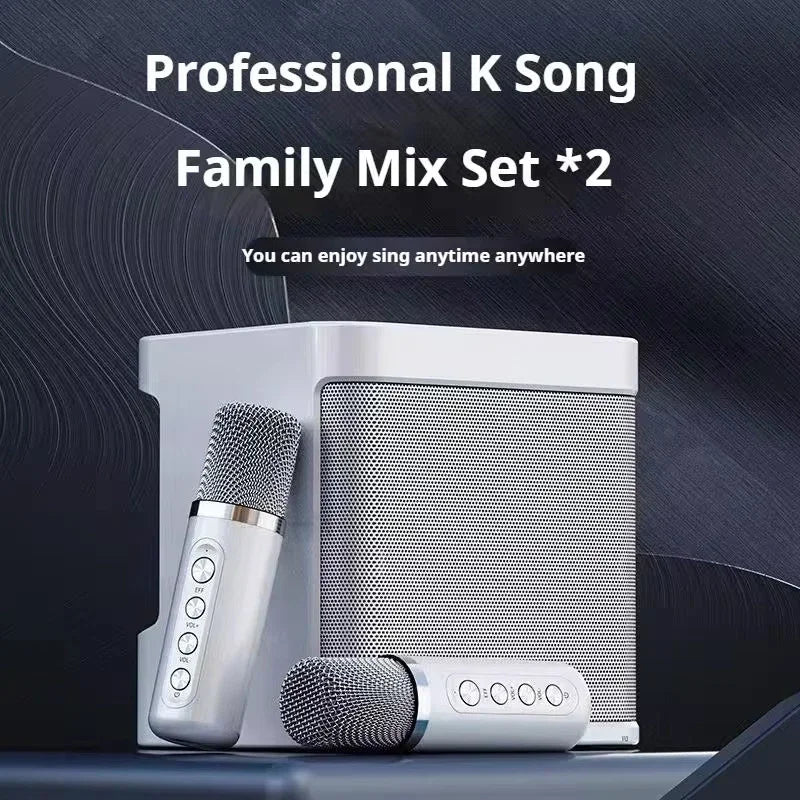 Silver wireless dual microphones with metallic grille and control buttons paired with portable boombox aux karaoke machine