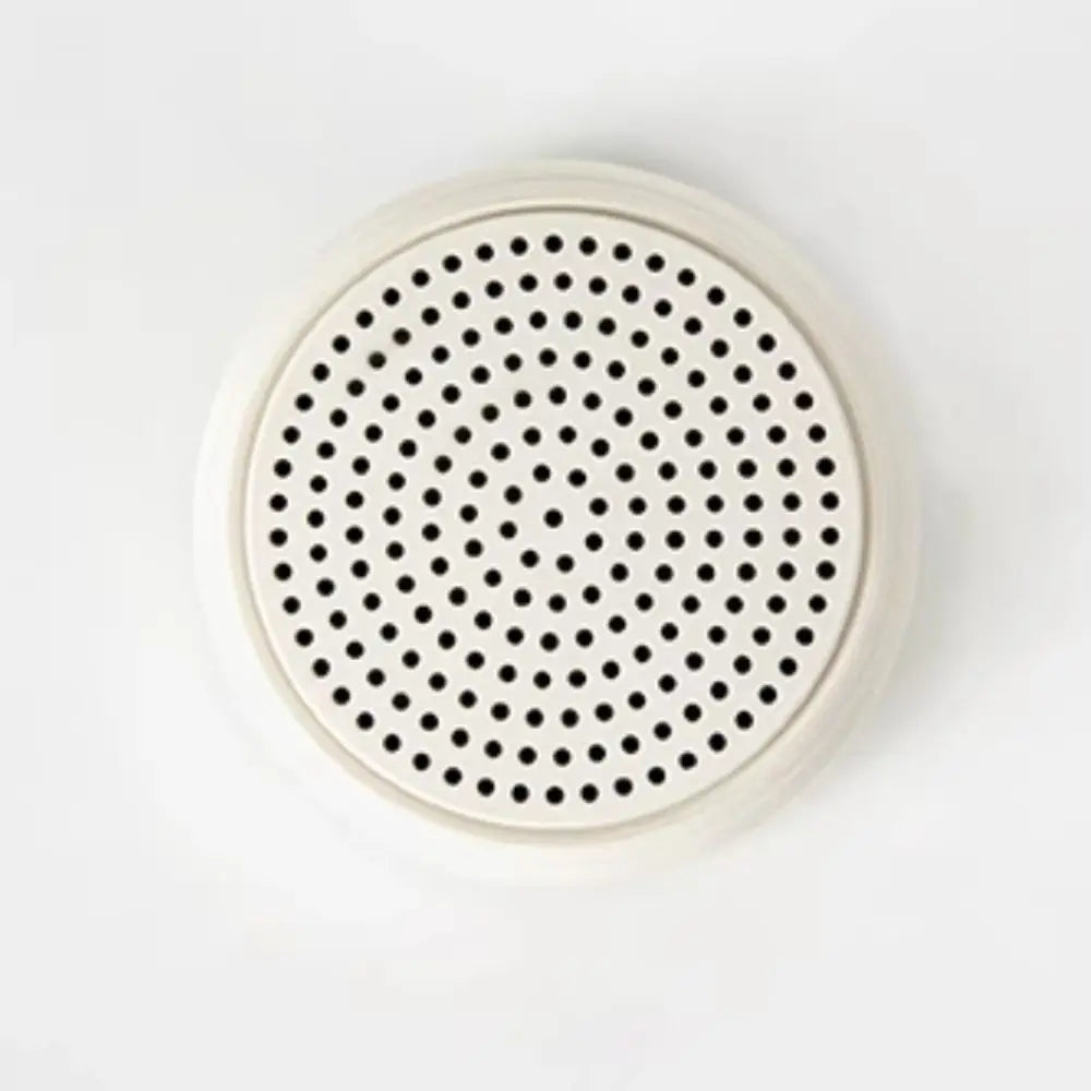 Off-white rechargeable music wireless karaoke mini bluetooth speaker with black perforated grille for home party use