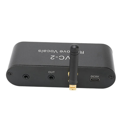 Black rectangular aluminum alloy karaoke vocal removal device with gold antenna and labeled output dc5v ports backside view