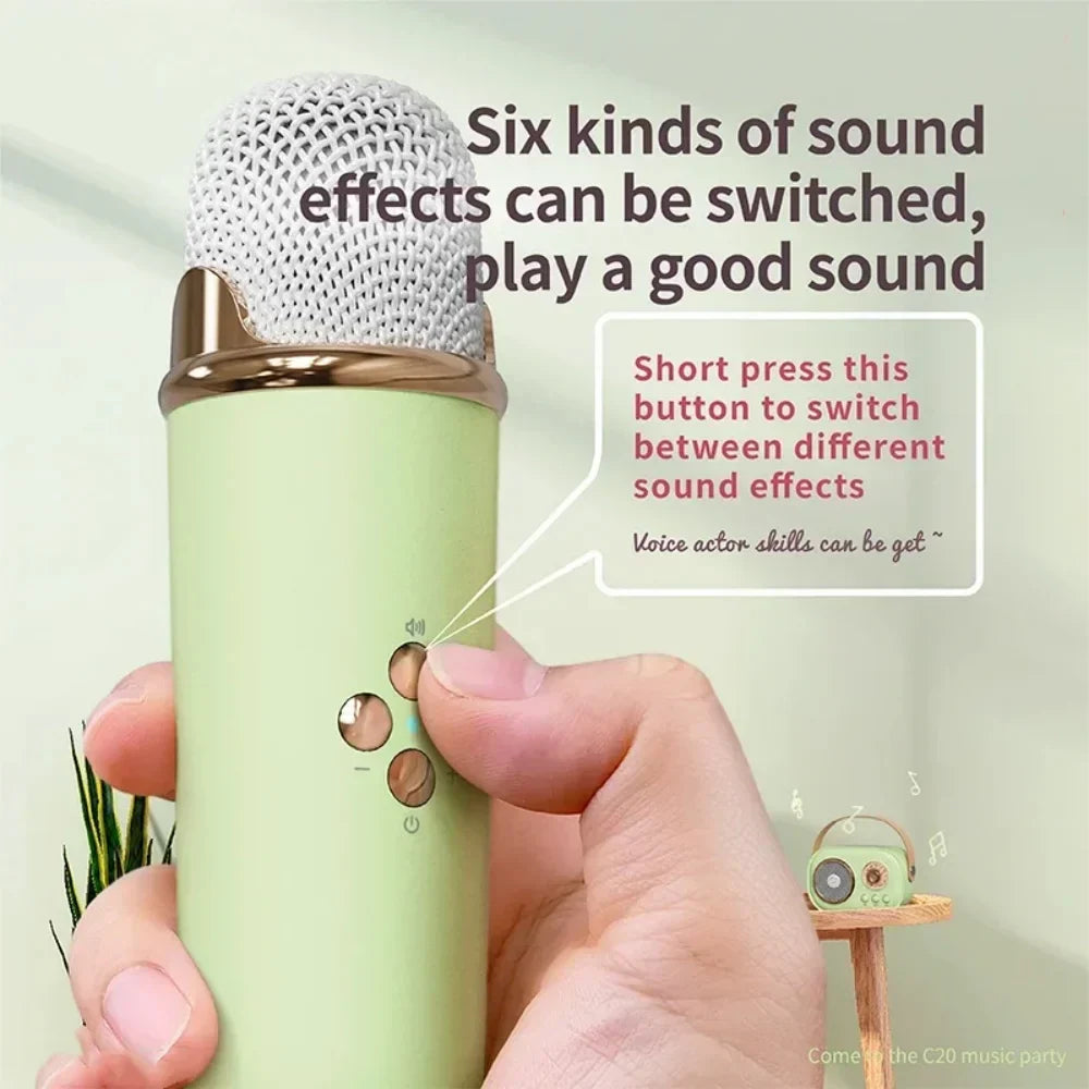 Light green cylindrical handheld karaoke wireless portable microphone with silver mesh grille and sound effect buttons for radio fm machine and small mp3 column use