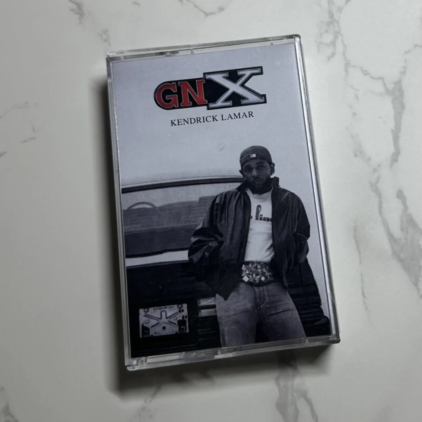 Clear plastic hip hop rap cassette tape case featuring kendrick lamar black and white photo and red gnx logo