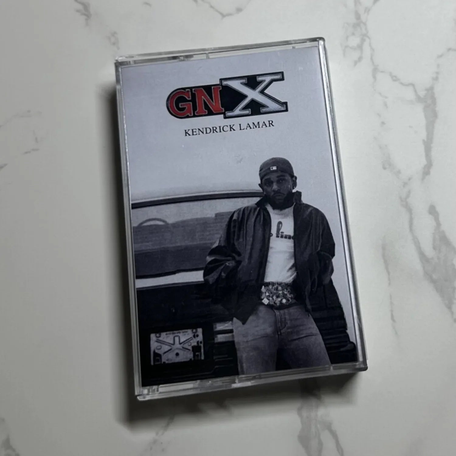 Clear plastic hip hop rap cassette tape case featuring kendrick lamar black and white photo and red gnx logo