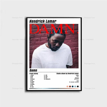Black-framed poster print of kendrick lamar damn album cover with bold red lettering and white t-shirt against brick wall