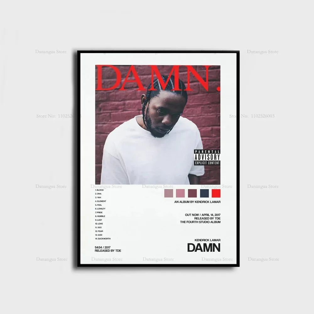 Black-framed kendrick lamar damn album cover poster with bold red lettering and white t-shirt on brick wall background