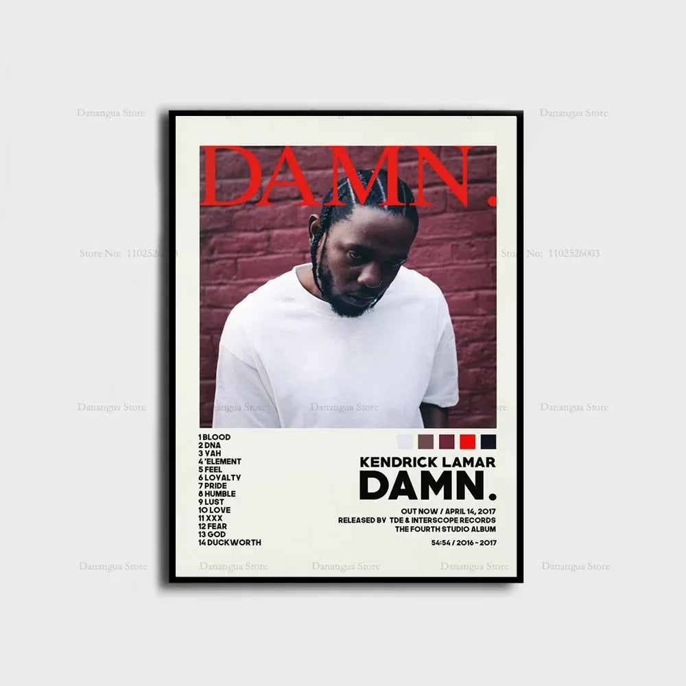 Black-framed kendrick lamar damn album cover poster with bold red text and white t-shirt against brick wall background