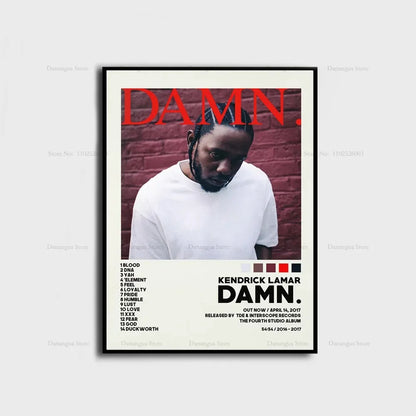 Black-framed kendrick lamar damn album cover poster with bold red text and white t-shirt against brick wall background