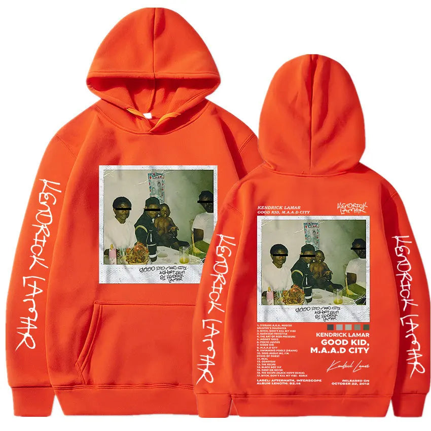 Vibrant orange kendrick lamar good kid album cover hoodie with printed graphic and white text signature on sleeves