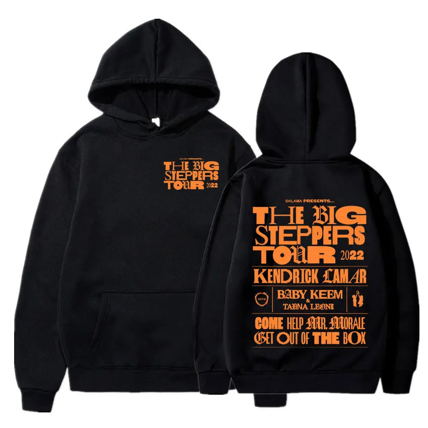 Black hoodie featuring bold orange the big steppers tour 2022 graphics and artist names on back for kendrick lamar good kid album cover hoodie