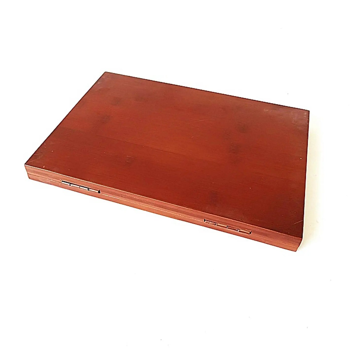 A rectangular reddish-brown bamboo keyboard music stand with smooth finish and visible grain for music score display