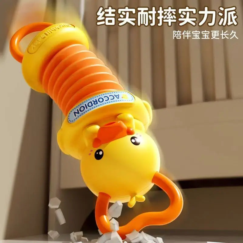 A yellow and orange rubber duck kids accordion toy with a spring mechanism by accordion for educational brain development and travel birthday gift