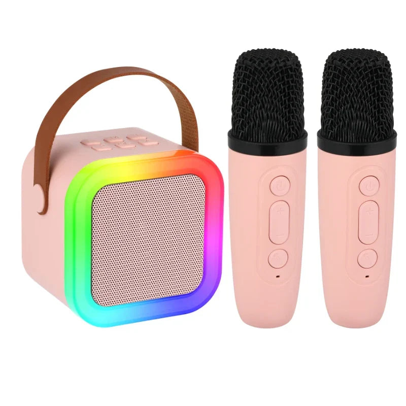 Pink karaoke machine portable with rainbow rgb light, brown leather handle, and two matching microphones with light voice changer