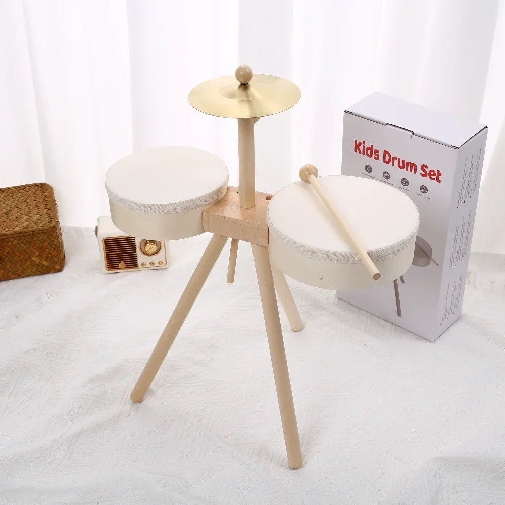 Minimalist wooden kids drum set with two white padded drums golden cymbal and sticks educational percussion toy