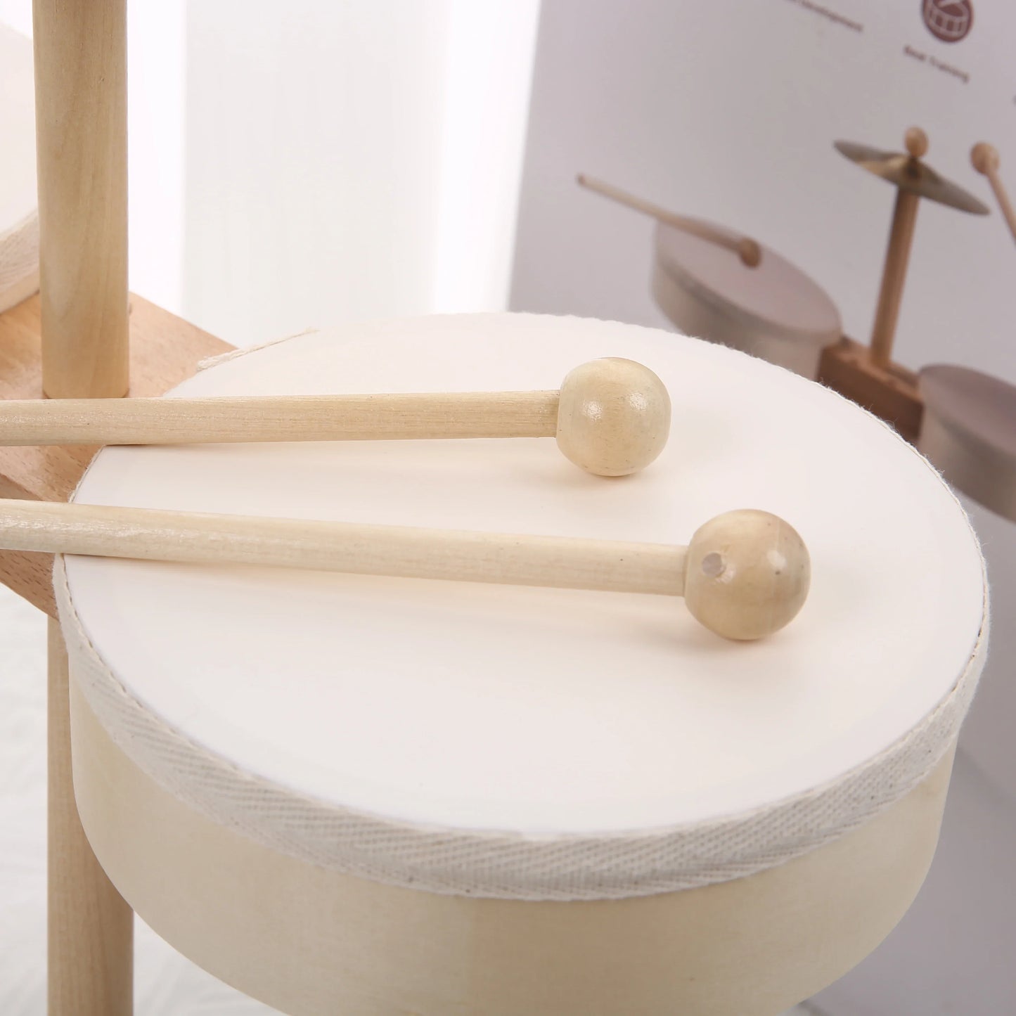 White drum with wooden mallets featured in kids musical instruments as an educational percussion toy music toy educational