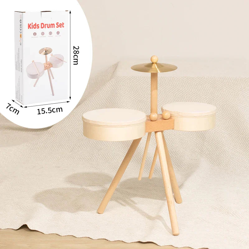 Wooden kids drum set with light natural wood frame and cream padded drums is an educational percussion toy