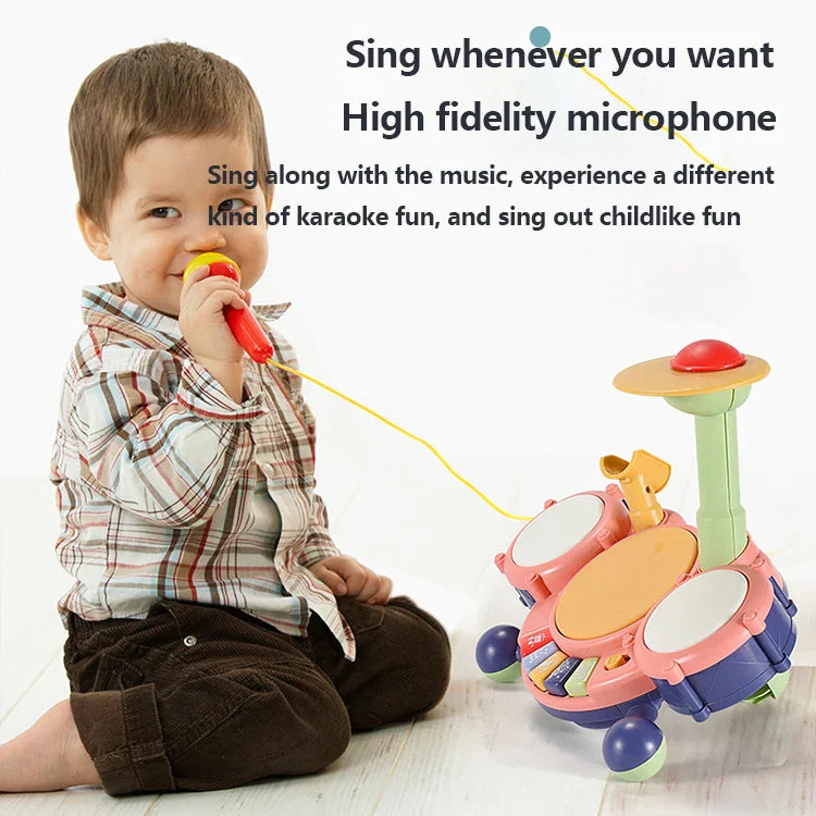 Kids jazz drums set with pink and blue plastic drums and yellow cord connected to red microphone multifunctional toddler play
