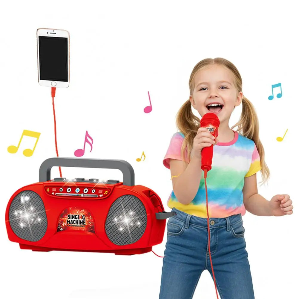Red plastic kids karaoke machine with gray speaker grilles and handle for outdoor travel educational gift use