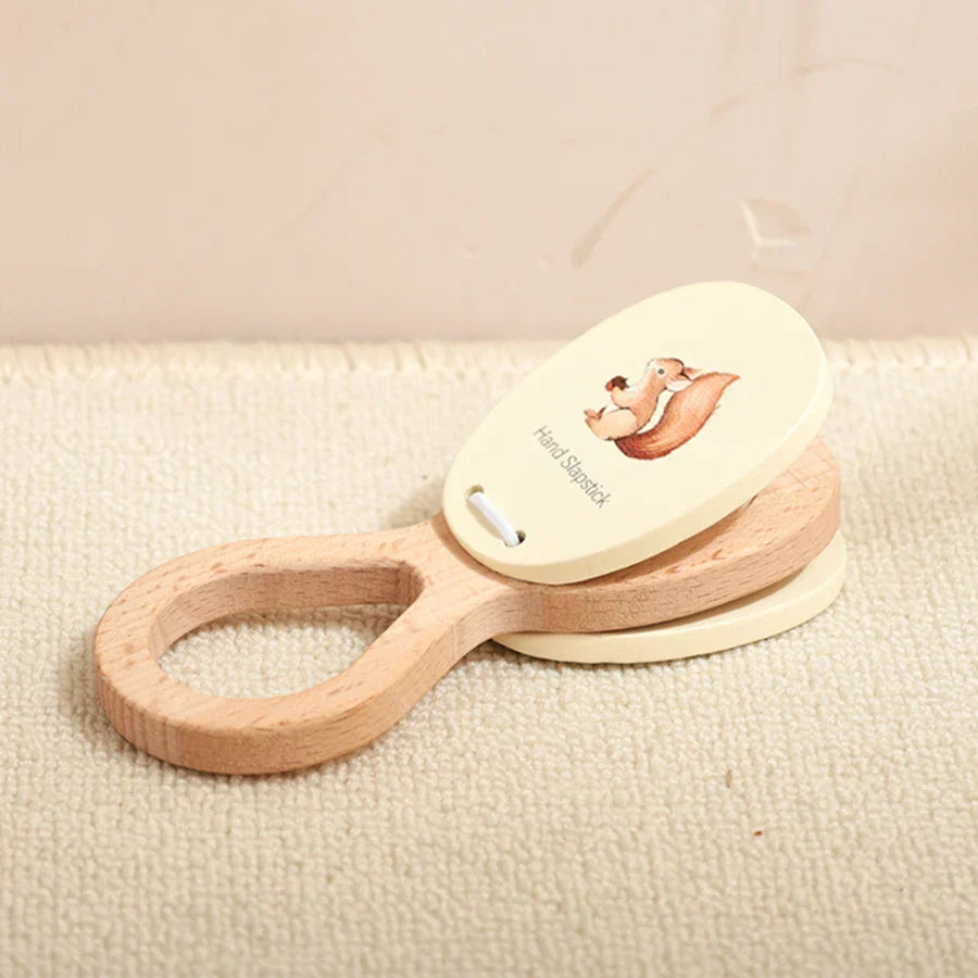 Wooden hand clapper with cream squirrel top plate and natural handle kids wooden montessori percussion toy