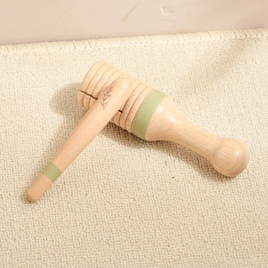 Light-colored wooden honey dipper with pale green bands for kids wooden montessori squirrel percussion instruments