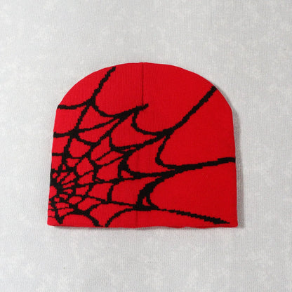 Red knit pile cap y2k with a black knitting spider web design suitable for goth hip-hop streetwear