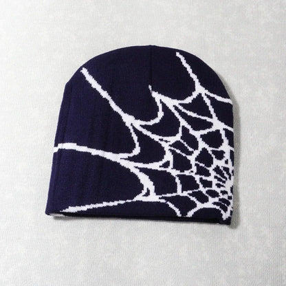 Navy blue knit beanie with bold white spiderweb pattern featuring knitting spider web design for cap y2k goth style