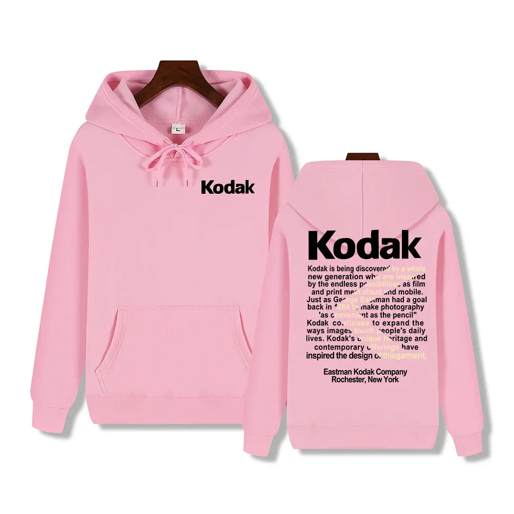 Back view of pink hooded sweatshirt with black kodak branding and printed text design for retro trend y2k sportswear autumn winter