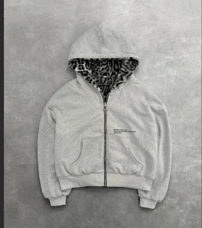 A light gray zip-up hoodie with leopard-print fleece lining and subtle chest text in korean fashion retro style