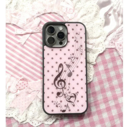 Back side of a korean ins pink plus y2k cover phone case with black polka dots and dot girl heart music note design