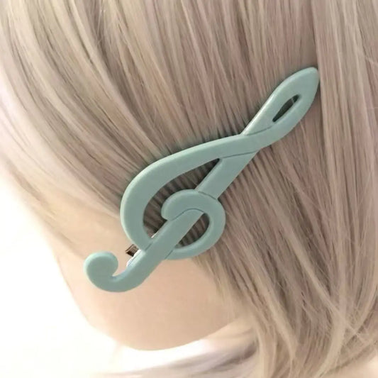 A mint green korean vintage music clip y2k duckbill plastic hair clip shaped like a treble clef for bangs women girls