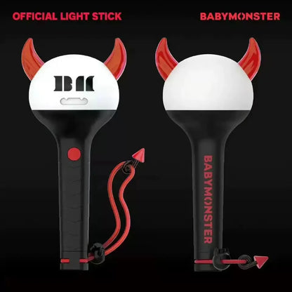 White and black devil-themed kpop babymonster official lightstick with red horns tail and bluetooth baemon concert features