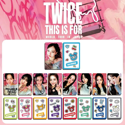 A collection of colorful glossy photocards featuring twice members and cute cartoon character designs from kpop idol two merch