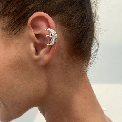 Silver crescent moon ear clip earring with smiling face and sphere accent in hip hop geometric pair sun moon style