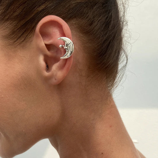 Silver crescent moon ear clip earring with smiling face and sphere accent in hip hop geometric pair sun moon style