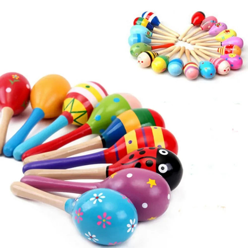 A collection of large montessori baby toy wooden colorful instrument rattle shaker maracas with hand-painted designs