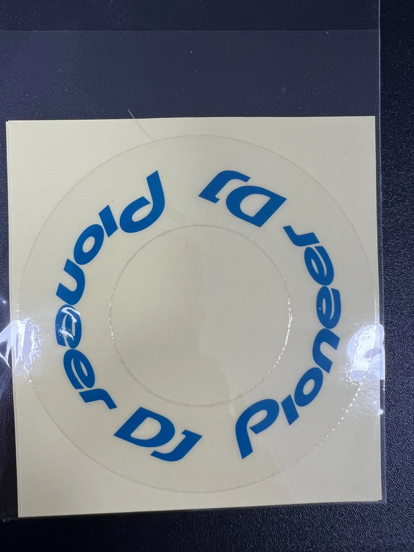 Clear circular sticker with blue pioneer dj logo on protective film cdj for large turntable at beat music store