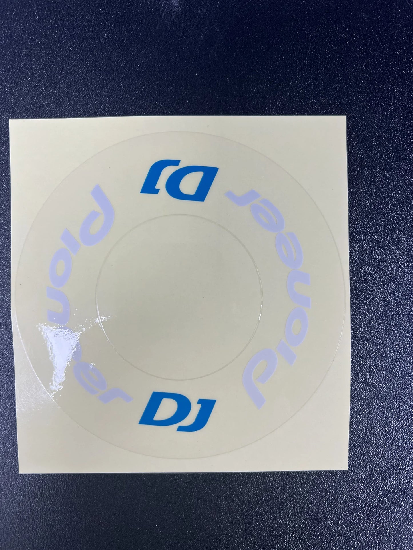 Clear circular sticker with pioneer dj logo in blue and light purple for protective film cdj on large turntable from beat music store