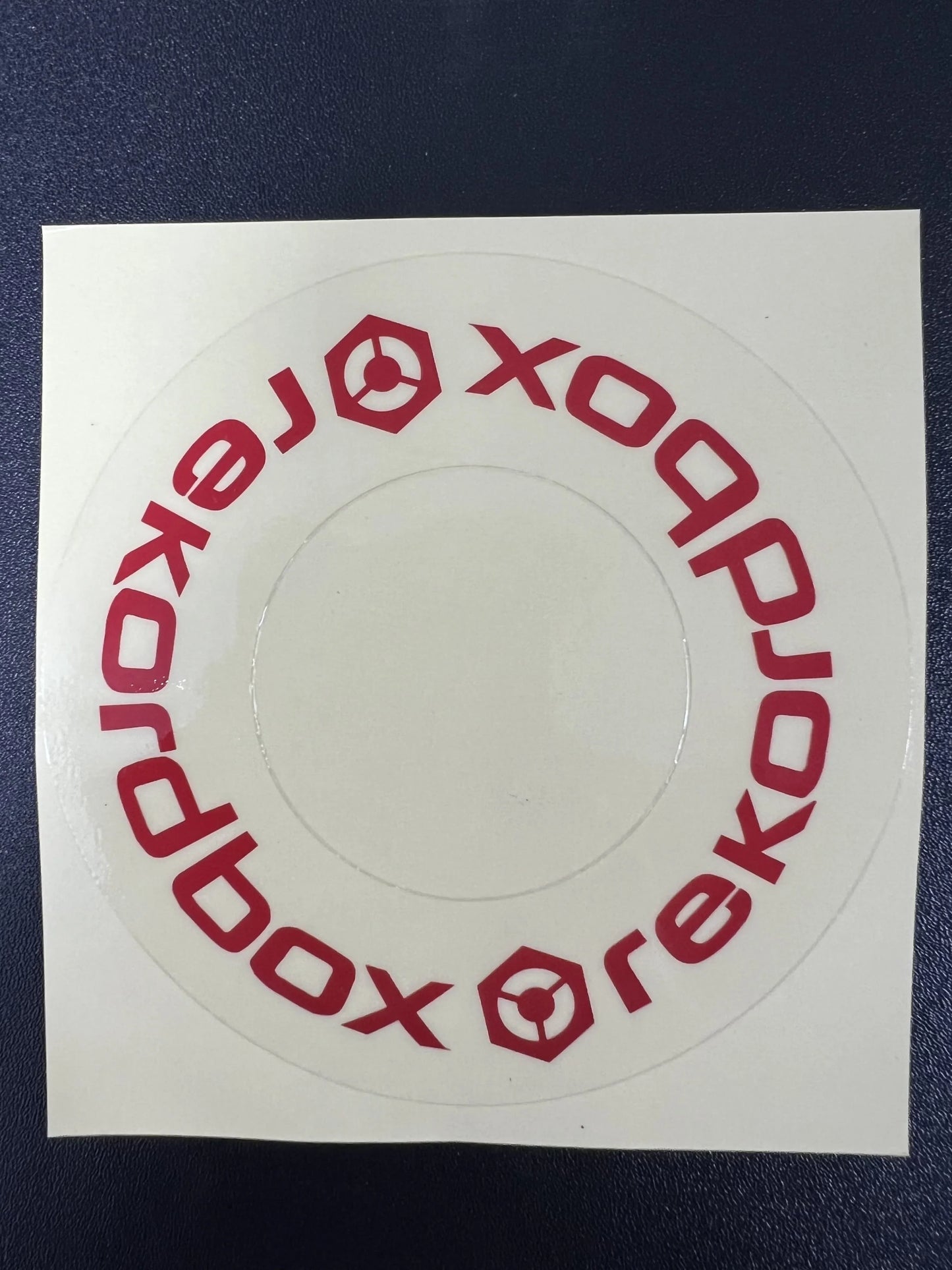 Red circular sticker with xoodobox logo on clear adhesive protective film cdj for large turntable at beat music store