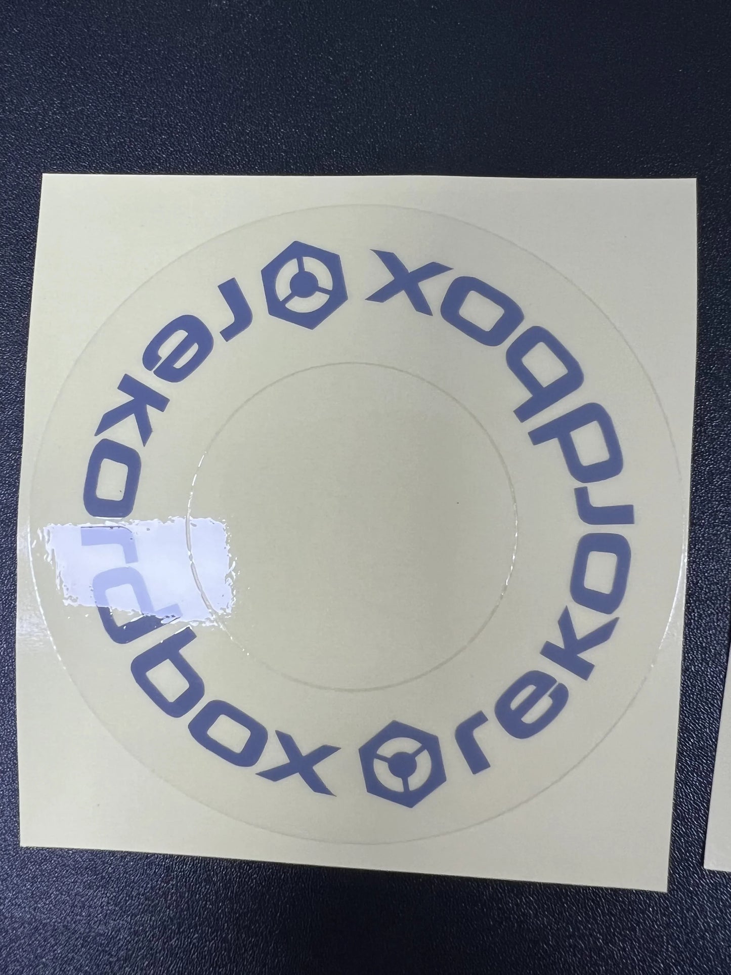 Clear circular sticker with blue xobox hexagonal logo on transparent adhesive for large turntable protective film cdj at beat music store